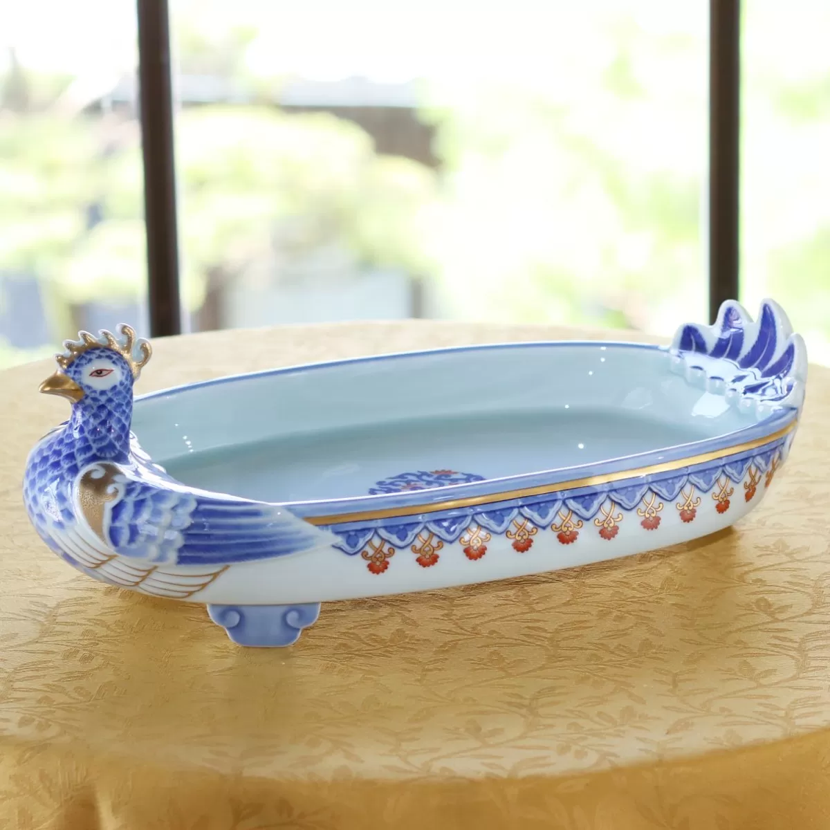 染錦陽刻孔雀紋